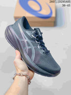 Dark gray ASICS running shoe with light reflective-style stripes and a dark outsole.