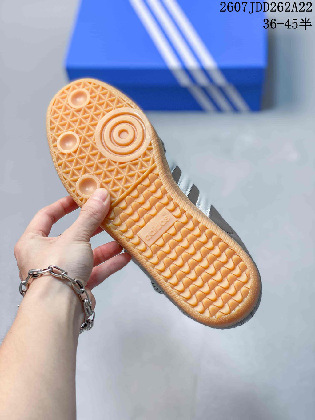 Close view of the gum-colored outsole showing its textured tread pattern.
