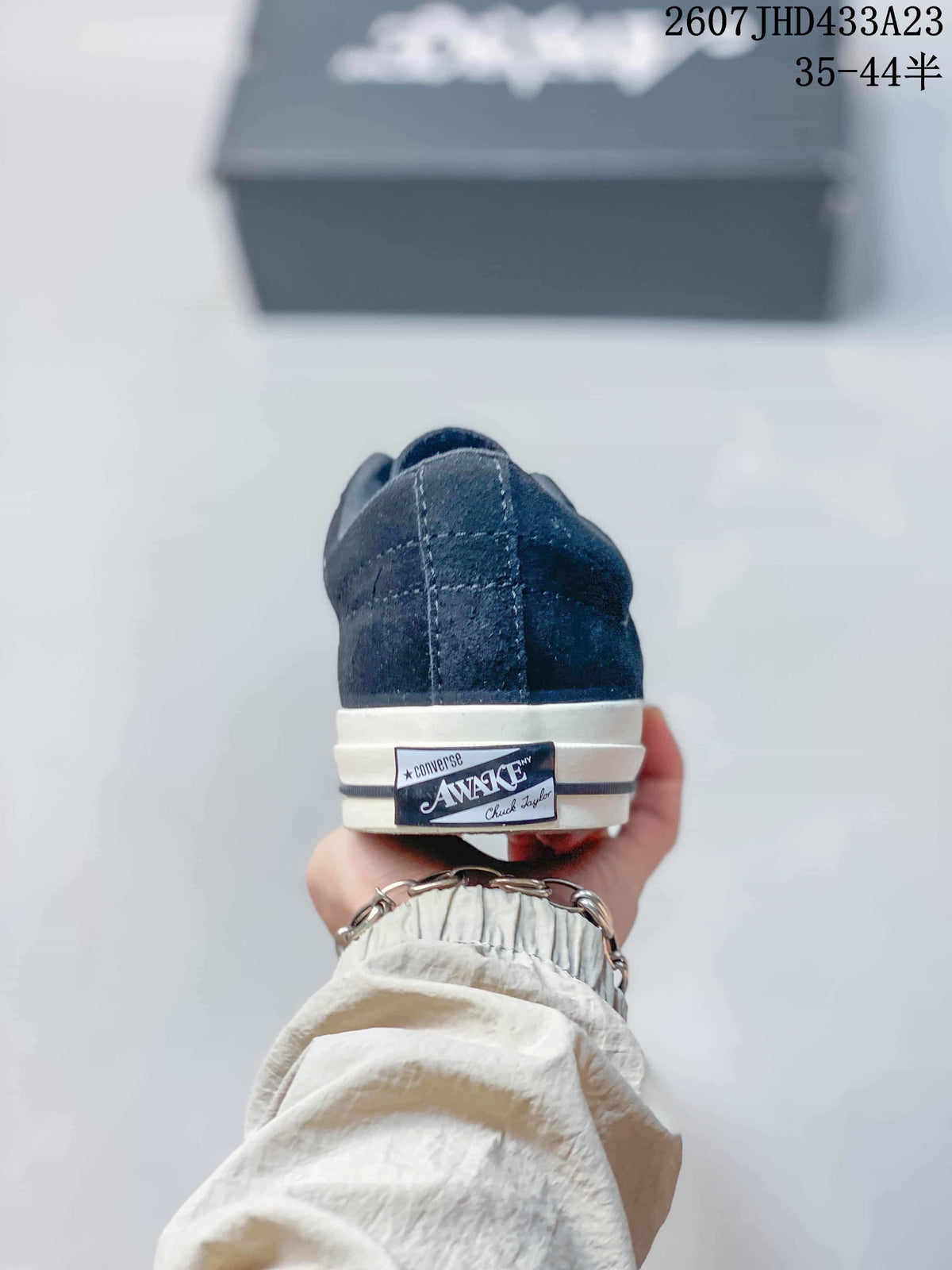Rear view showing the dark navy heel and Converse Awake heel label.