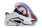 Side and outsole views of white and black Jordan Luka 3 shoes with patterned panels