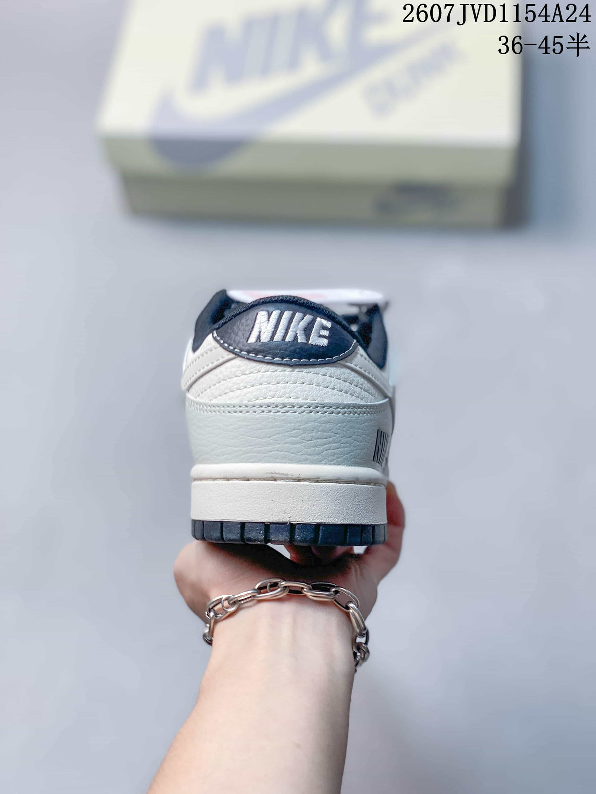 Rear view of the sneaker showing the Nike heel tab, white textured upper and dark outsole edge.
