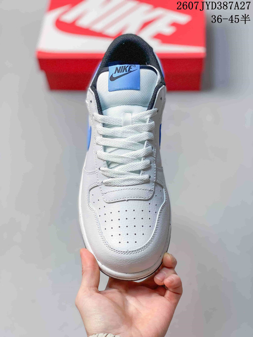 Top view showing the perforated toe panel, white laces and padded tongue.