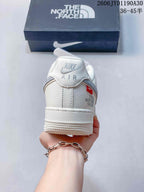 Rear view of the off-white sneaker with Nike Air branding and The North Face side detail