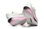 White Nike Zoom Fly 6 shoes showing pink and white outsole details