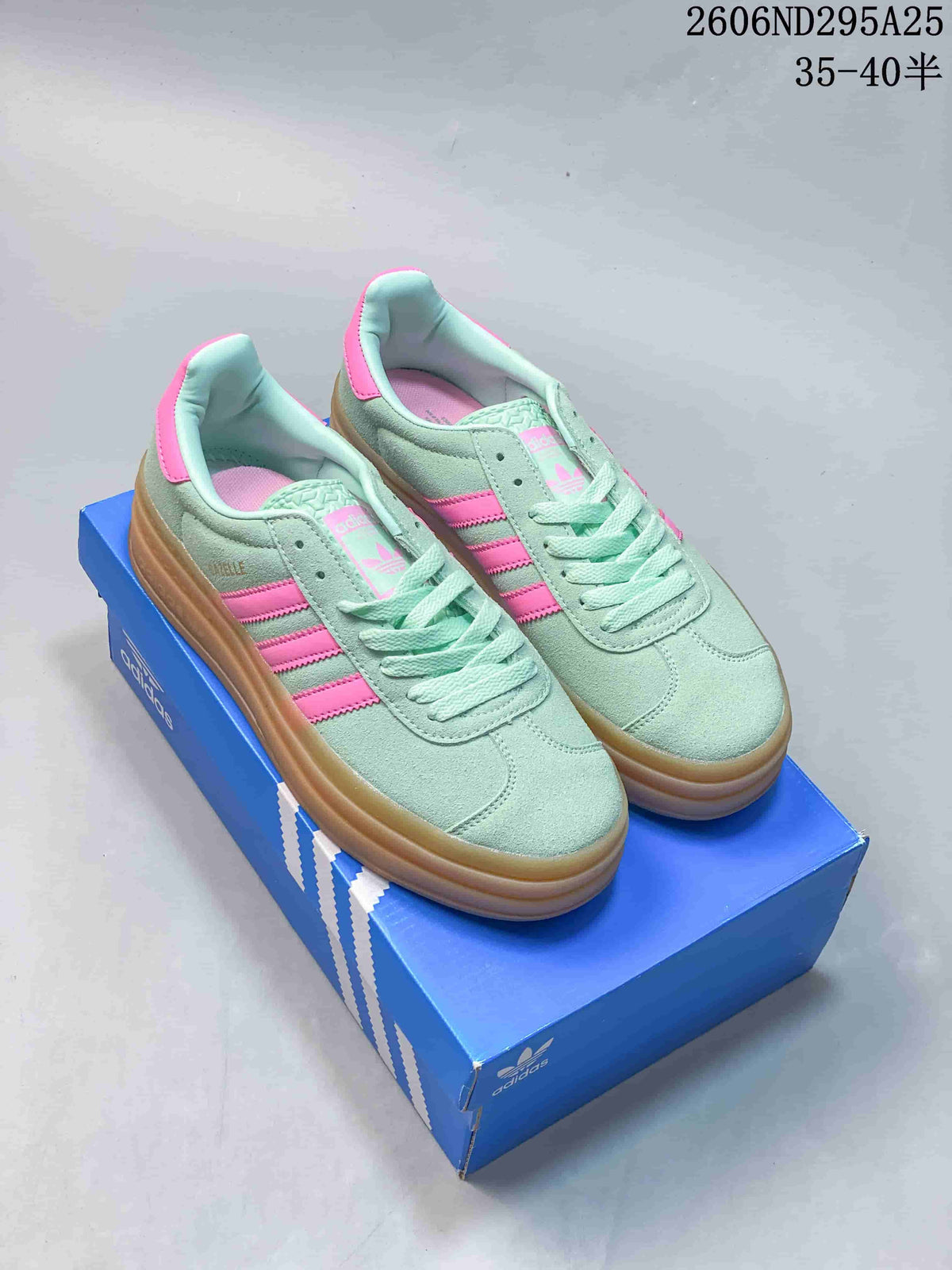 Pair of mint green and pink adidas Gazelle Bold sneakers displayed on a blue adidas shoe box; image text shows code 2606ND295A25 and size range 35–40.5.