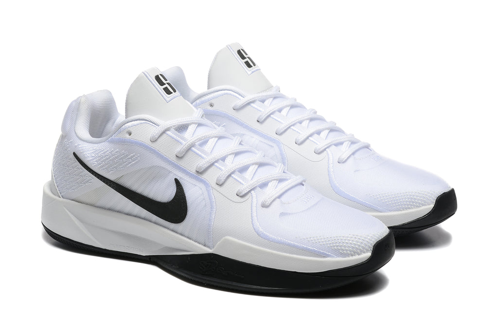 Side view of white basketball shoes with black Swooshes and white laces