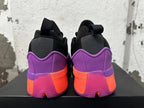 Rear view of purple, black and coral adidas Dame 9 shoes