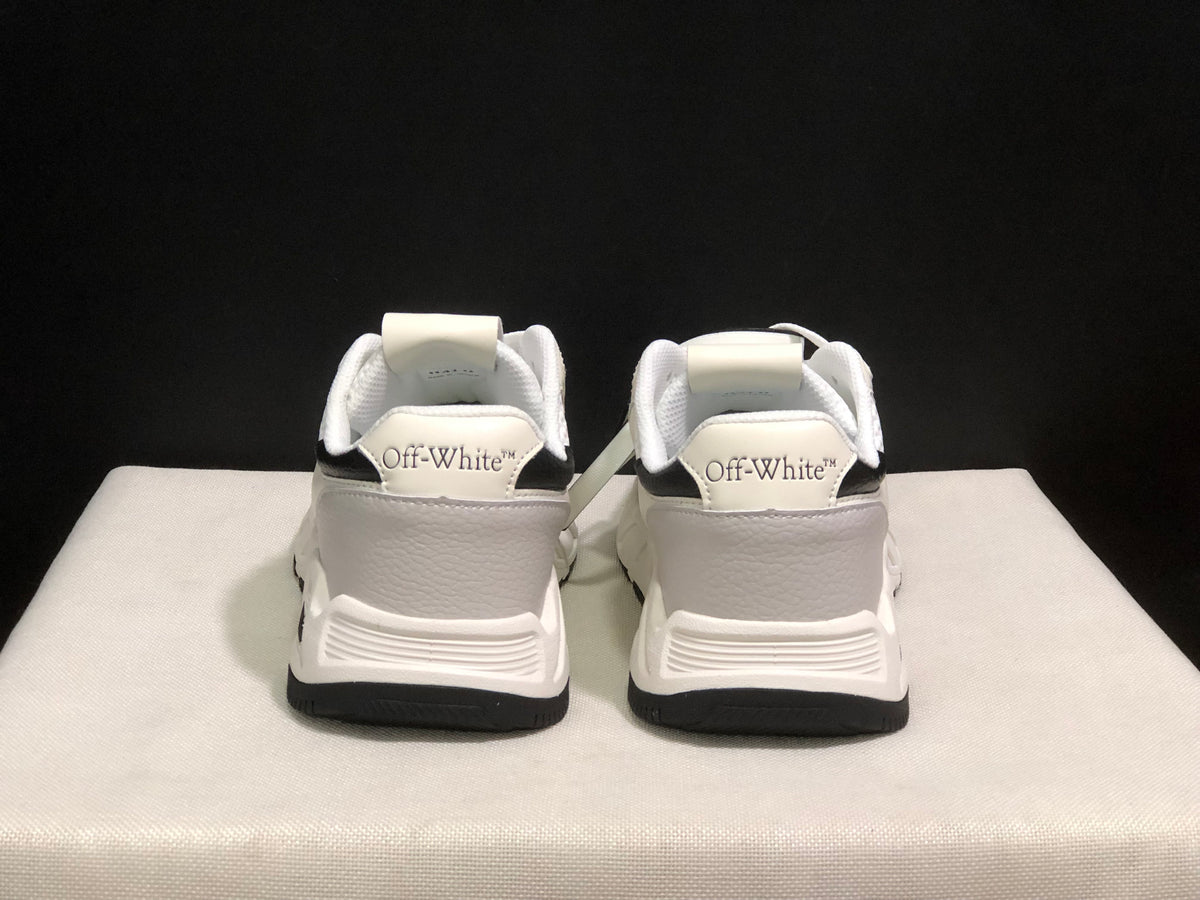 Rear view of the sneaker pair showing Off-White branding on the heel panels and black outsole edges.