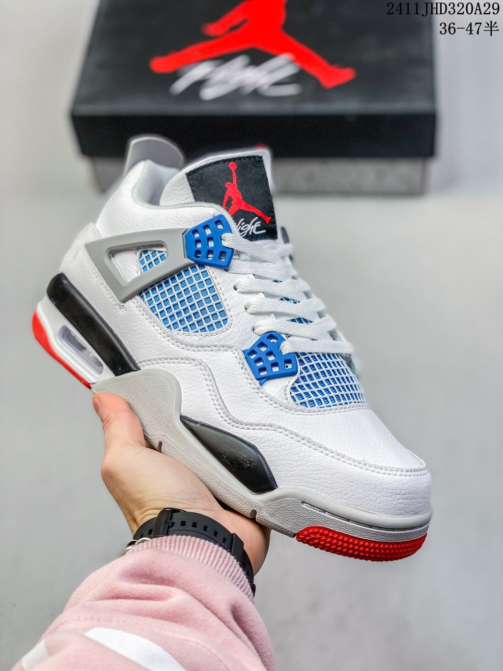 Close-up of a white high-top sneaker with blue eyelets and blue side mesh, plus grey and red outsole details.