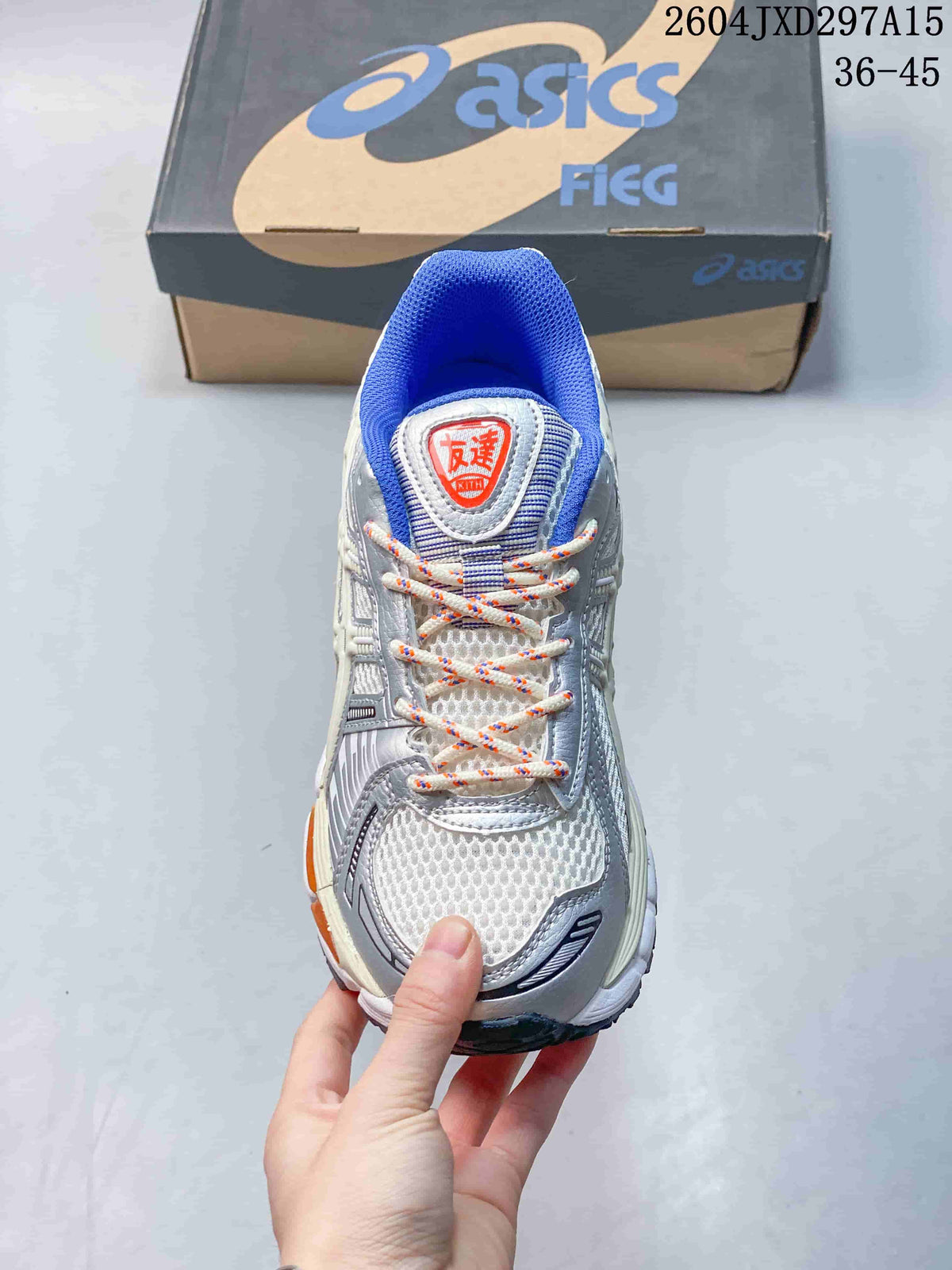 Top view of a sneaker showing multicolored laces, blue collar lining, and a light mesh-like upper