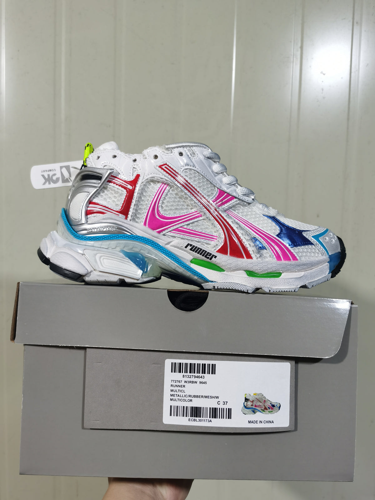 Puma Runner sneaker in white, silver, red, pink, blue, and green with its box; the box label shows Runner, Multicolor, and size 37.
