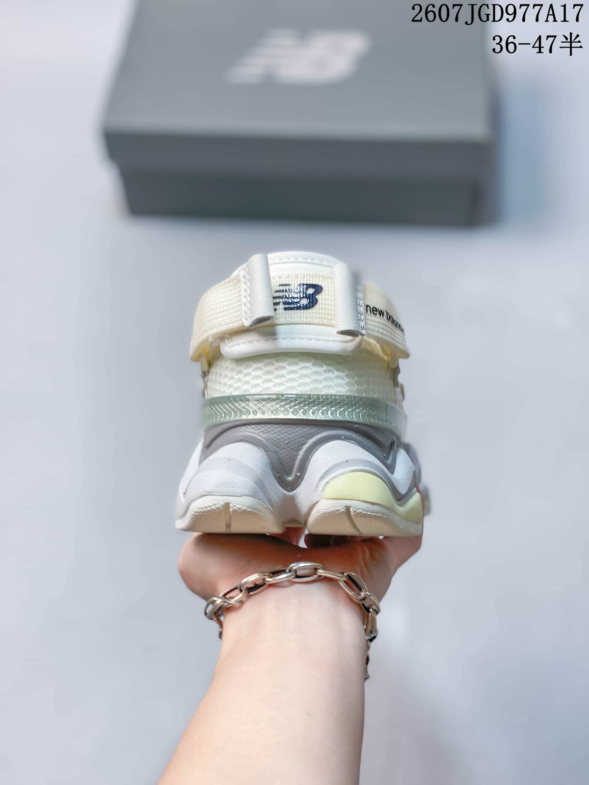 Rear view showing the padded heel structure, folded-heel design, and layered sole.