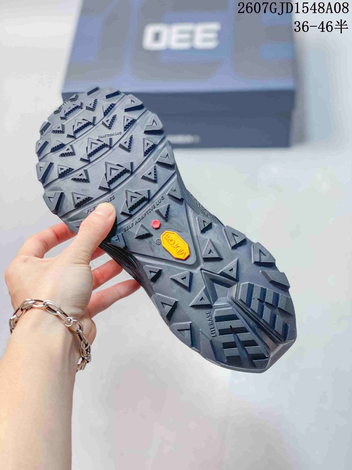 Close view of the Kailas shoe outsole showing deep triangular lugs and a Vibram marking.