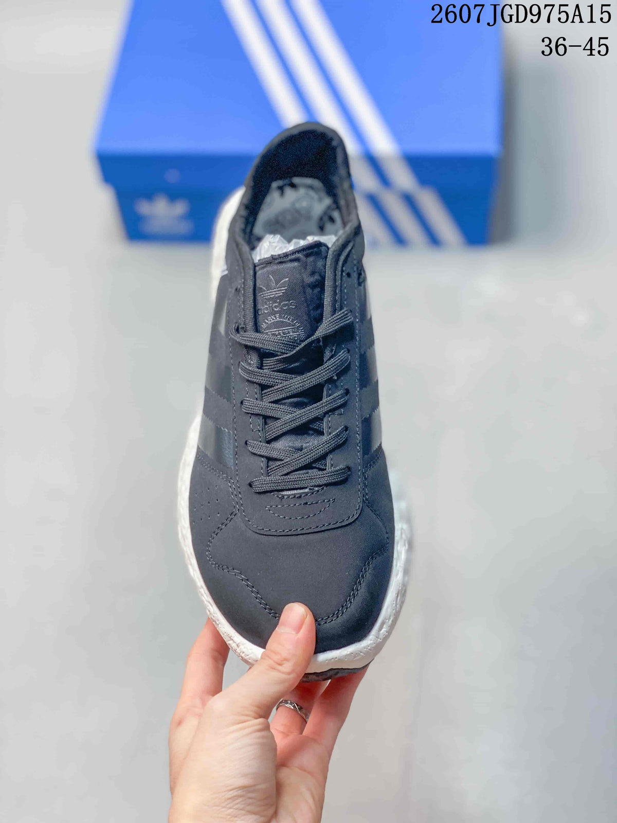 Top view showing the lace-up closure, padded tongue, perforated toe area, and dark upper.