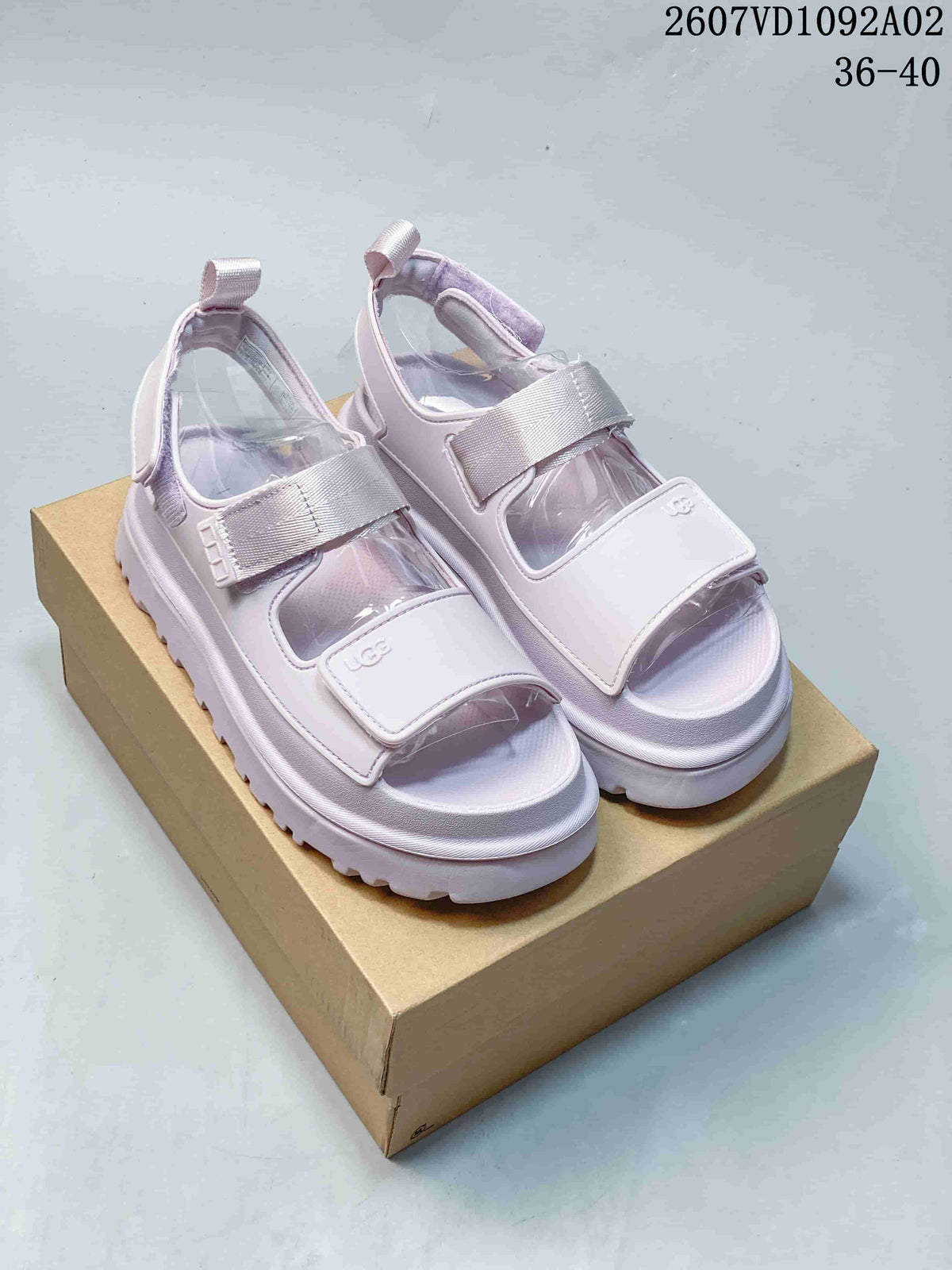 Pale lavender platform sandals with adjustable straps, shown as a pair.