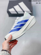 Side profile of the white sneaker with blue patterned stripes and a raised athletic midsole.