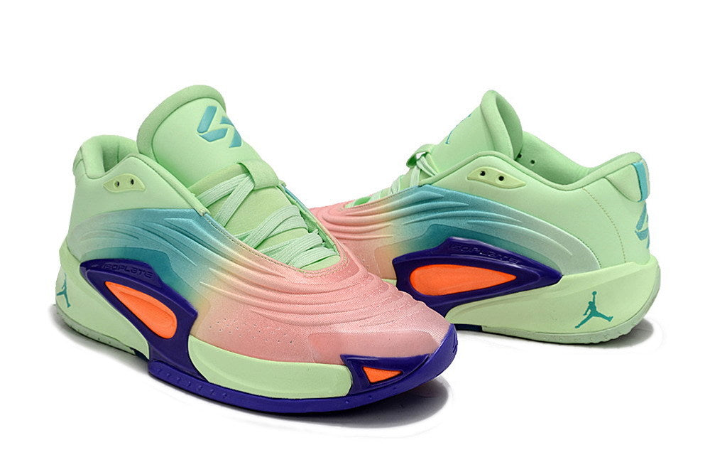 Pair of mint green Jordan Luka 3 shoes with pink and blue gradient panels
