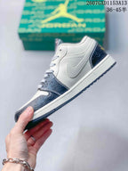 Side profile showing the white upper, layered overlays, patterned forefoot panel, and dark outsole.