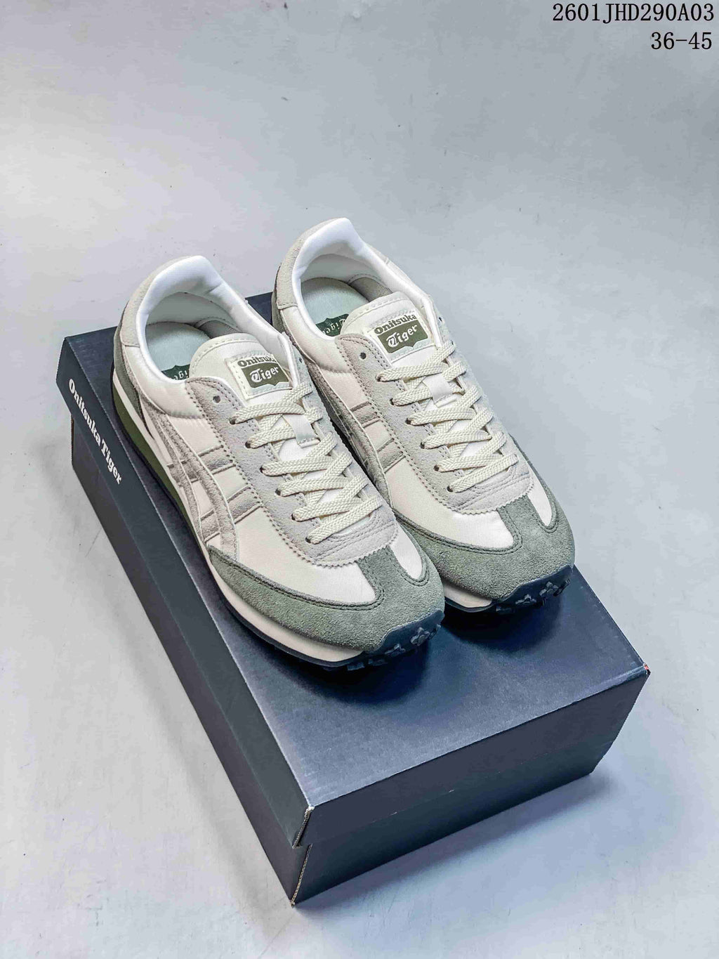 Pair of off-white and gray-green Onitsuka Tiger EDR 78 sneakers displayed on a branded box.