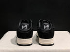 Rear view showing paired sneakers with Bape Sta branding on the heel tabs.