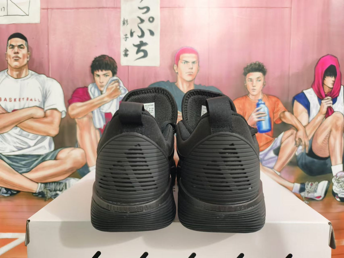 Rear view of all-black Nike basketball shoes showing the heel and outsole details