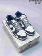 Pair of Nike SB Dunk Low sneakers in an off-white, dark navy and red color-block design, displayed on a patterned shoebox; product code and a 36–45 size range are overlaid in the upper-right corner.