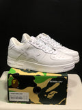 White BAPE Bape Sta sneakers displayed on a camouflage BAPE shoe box; the box label shows US 9.5, UK 8.5, EU 43, and CM 27.5.