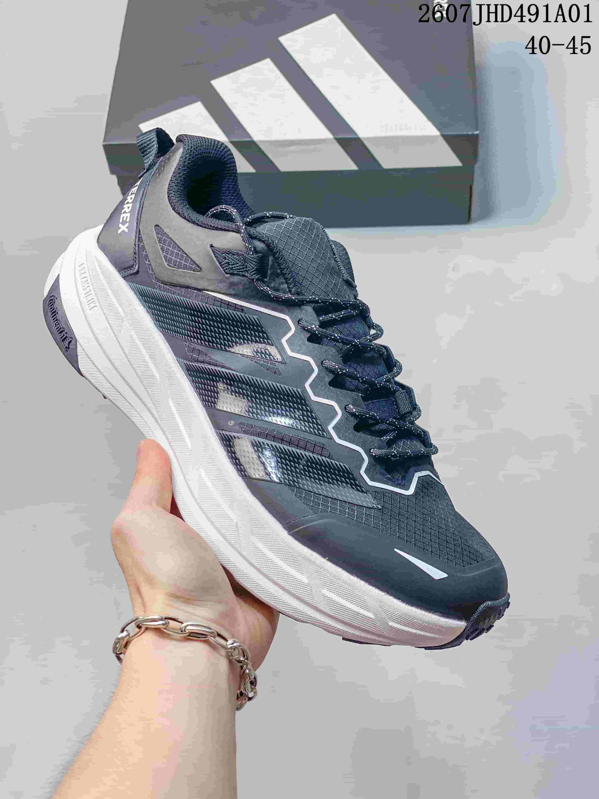 Dark gray Adidas Terrex low-top shoe with a white sole; image displays the size range 40–45.