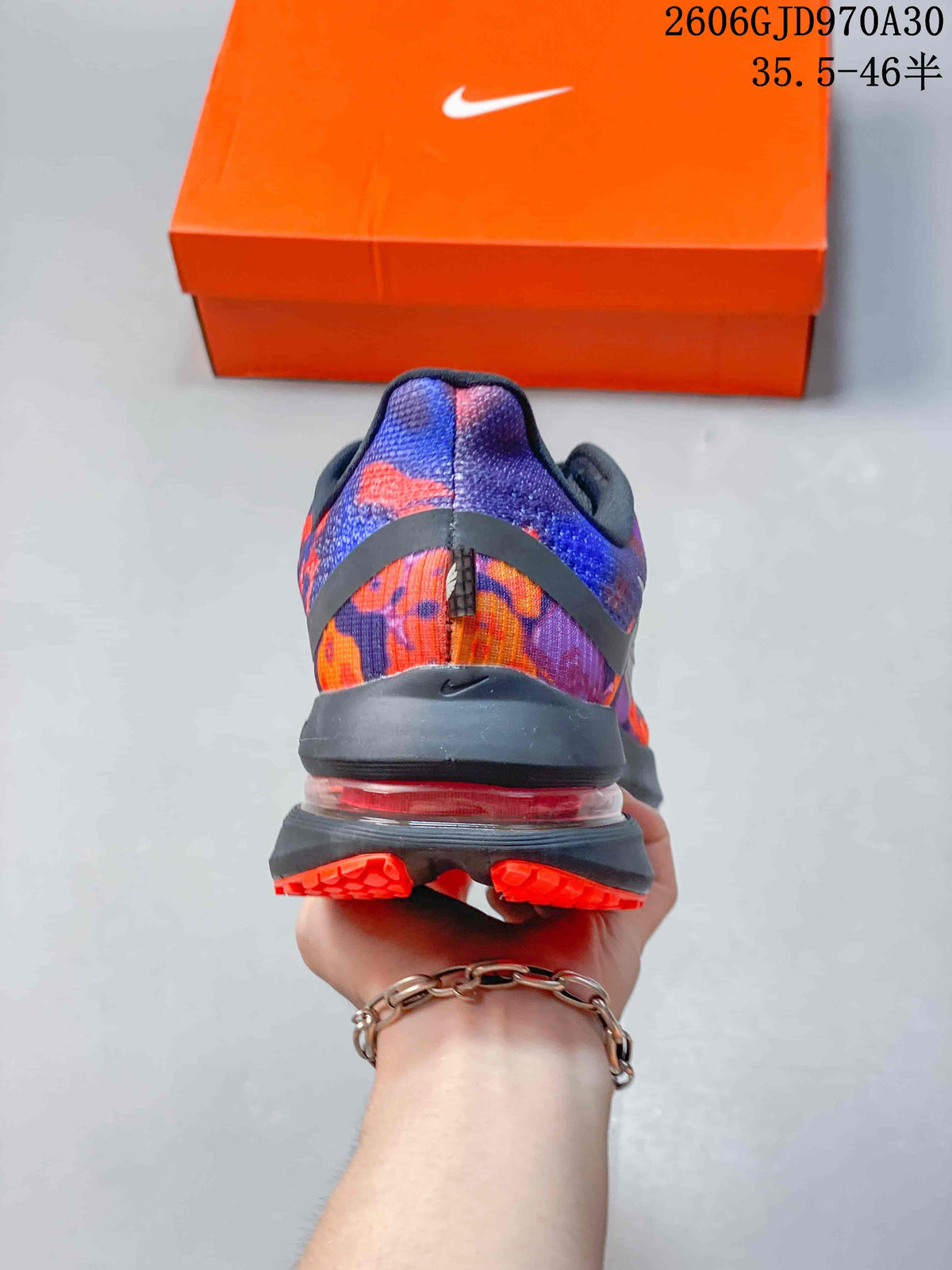 Rear view of the patterned running shoe showing the heel and visible cushioning element