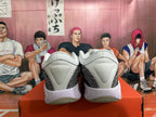 Rear view of white, grey, and black Nike-style basketball sneakers