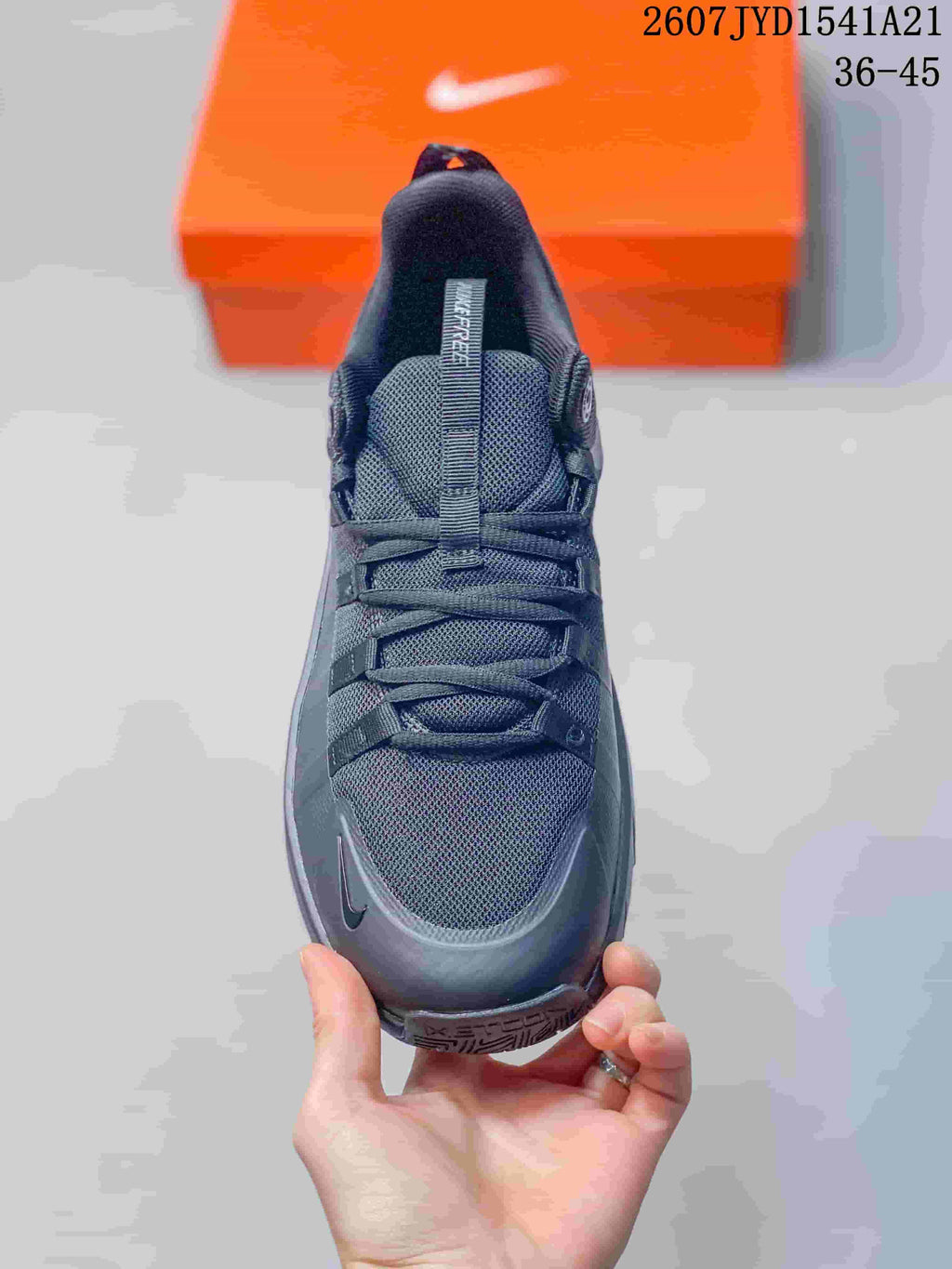 Top view of the black sneaker showing the mesh-look toe box, tongue and laces.