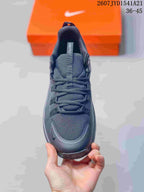 Top view of the black sneaker showing the mesh-look toe box, tongue and laces.