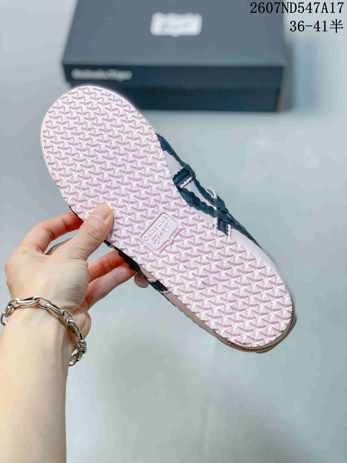 Close view of the pale pink textured outsole with repeating tread and molded branding.