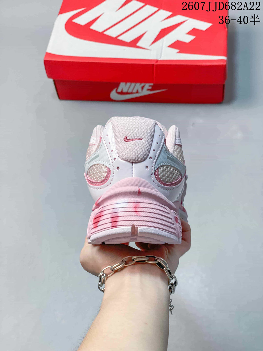 Rear view showing the layered heel design, mesh panels, and chunky sole.