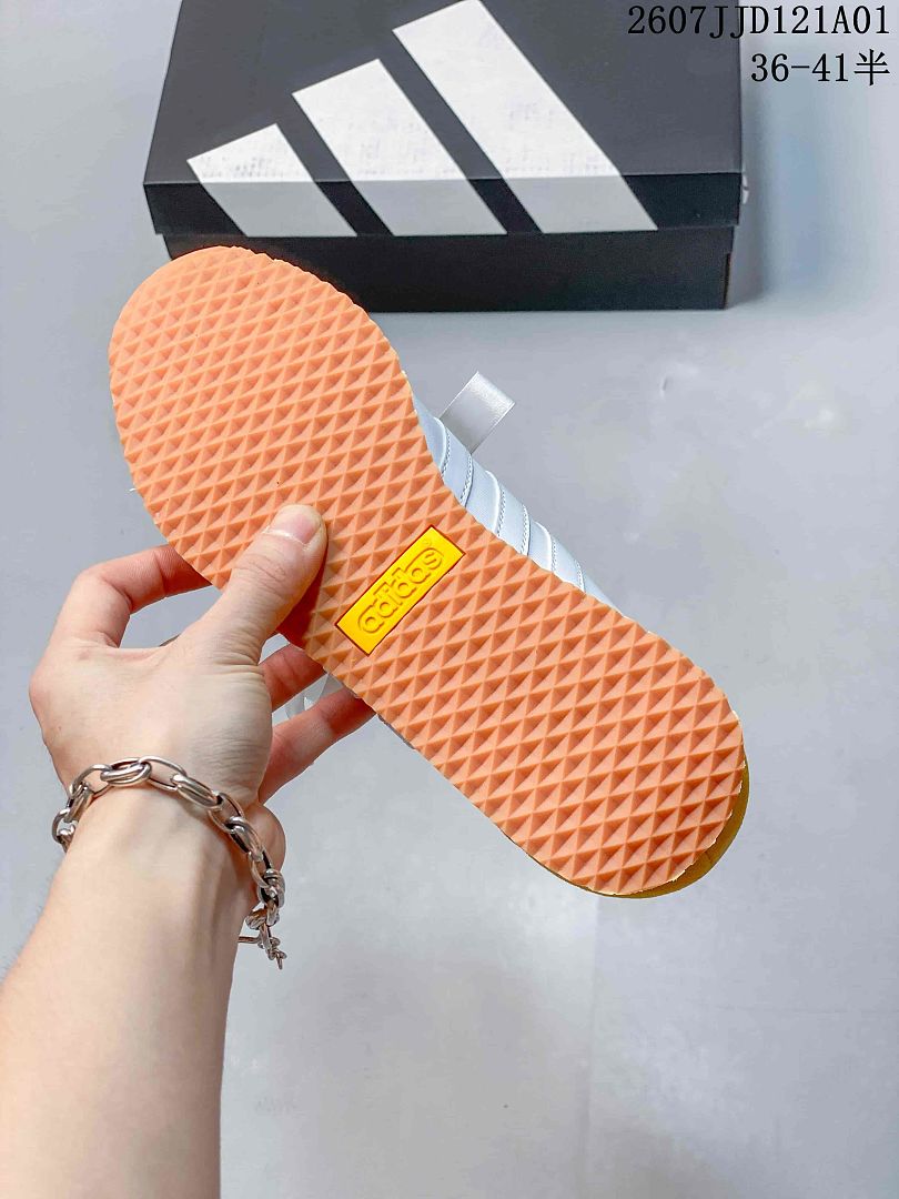 Close-up of the textured gum-colored outsole on an adidas VS JOG 2.0 sneaker.