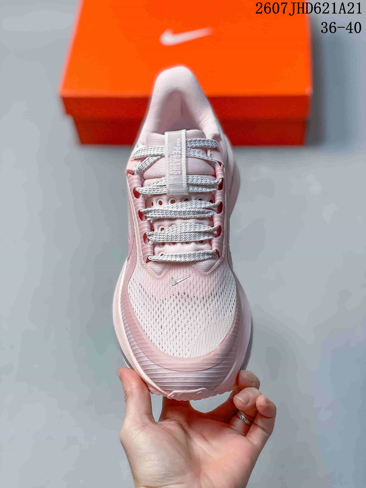 Top view showing the pink mesh-look toe box, laces and tongue branding.
