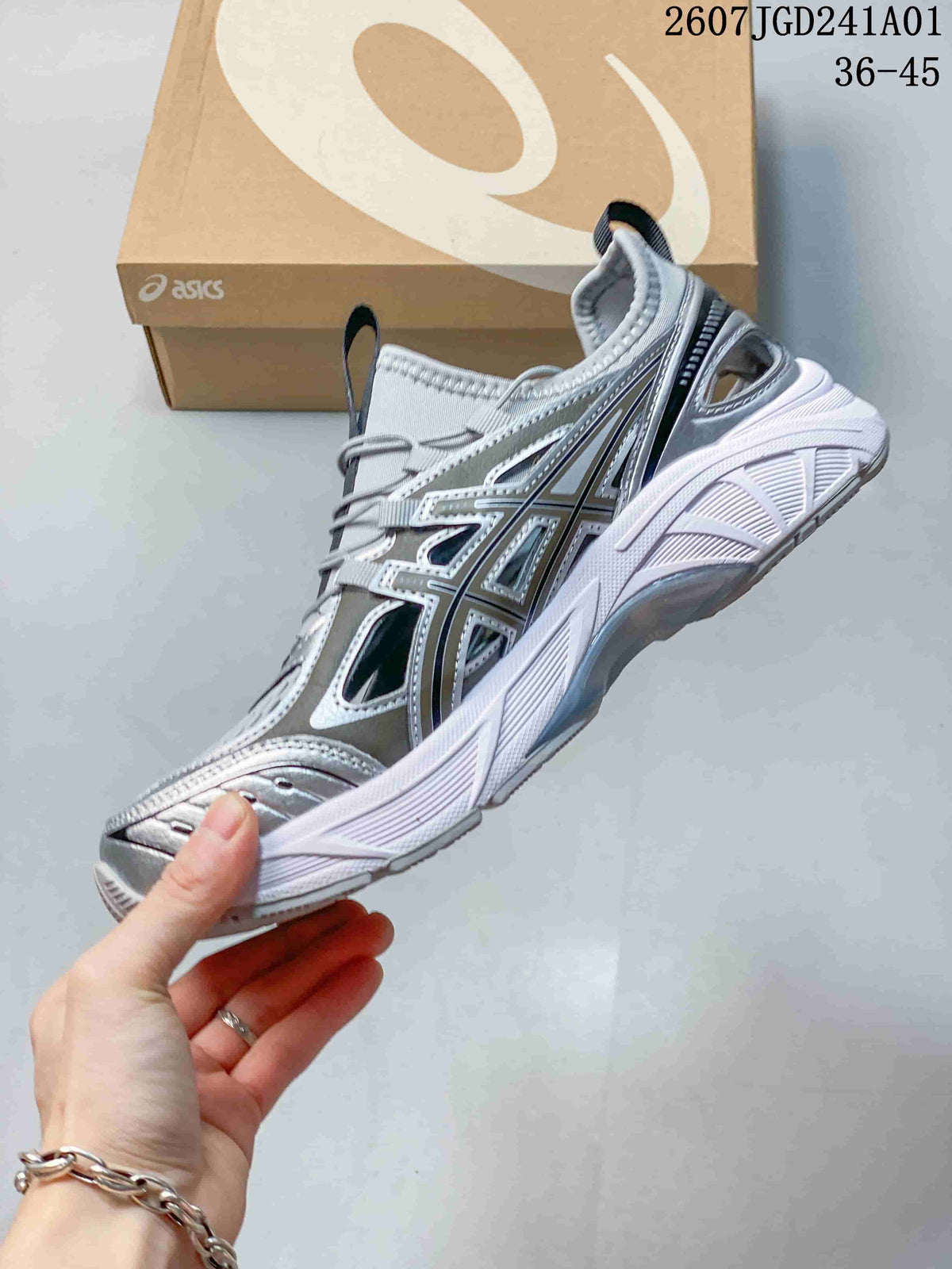Side profile of a silver-toned ASICS GT-2160 Breeze sneaker with layered overlays and elastic laces.
