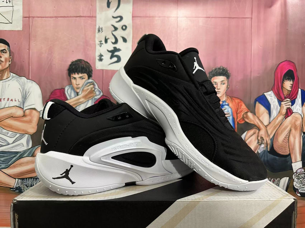 Angled side view of black and white Jordan basketball shoes