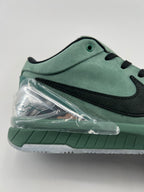 Close-up of the green heel and clear heel accent above the outsole