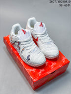 Pair of white and red Nike Ja 3 basketball shoes displayed on a red horse-patterned box.