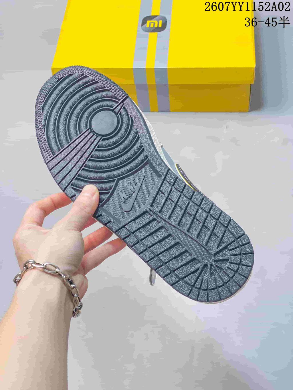 Close-up of the dark grey patterned outsole