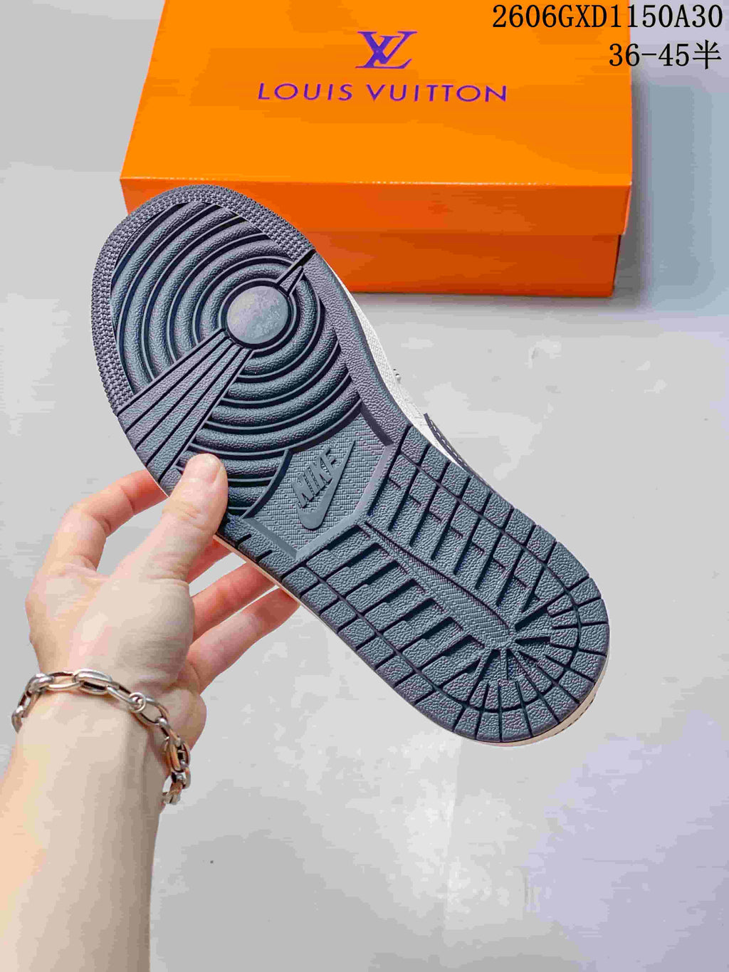 Close-up of the dark patterned outsole of the sneaker