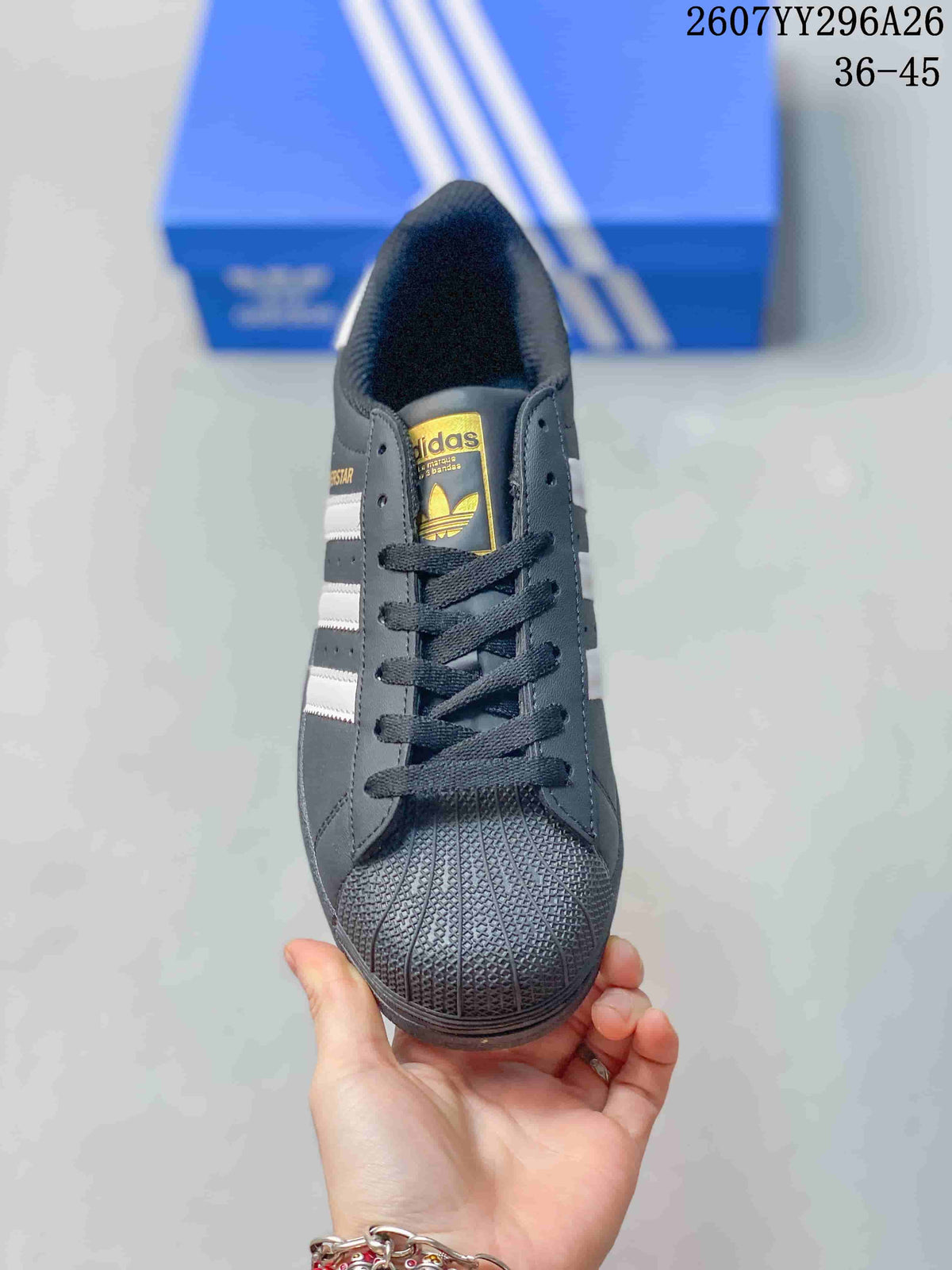 Top view showing black laces, a textured shell-style toe, dark lining, and adidas tongue branding.