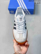 Top view showing the white laces, textured toe panel, and adidas tongue branding.