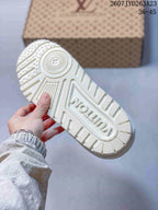 Underside of a white sneaker showing a textured outsole with radial grooves, raised branding and patterned tread; image text shows code 2607JYD263A23 and size range 36–45.
