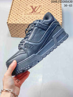 Side view showing the low-top sneaker's panels, branding, and chunky outsole