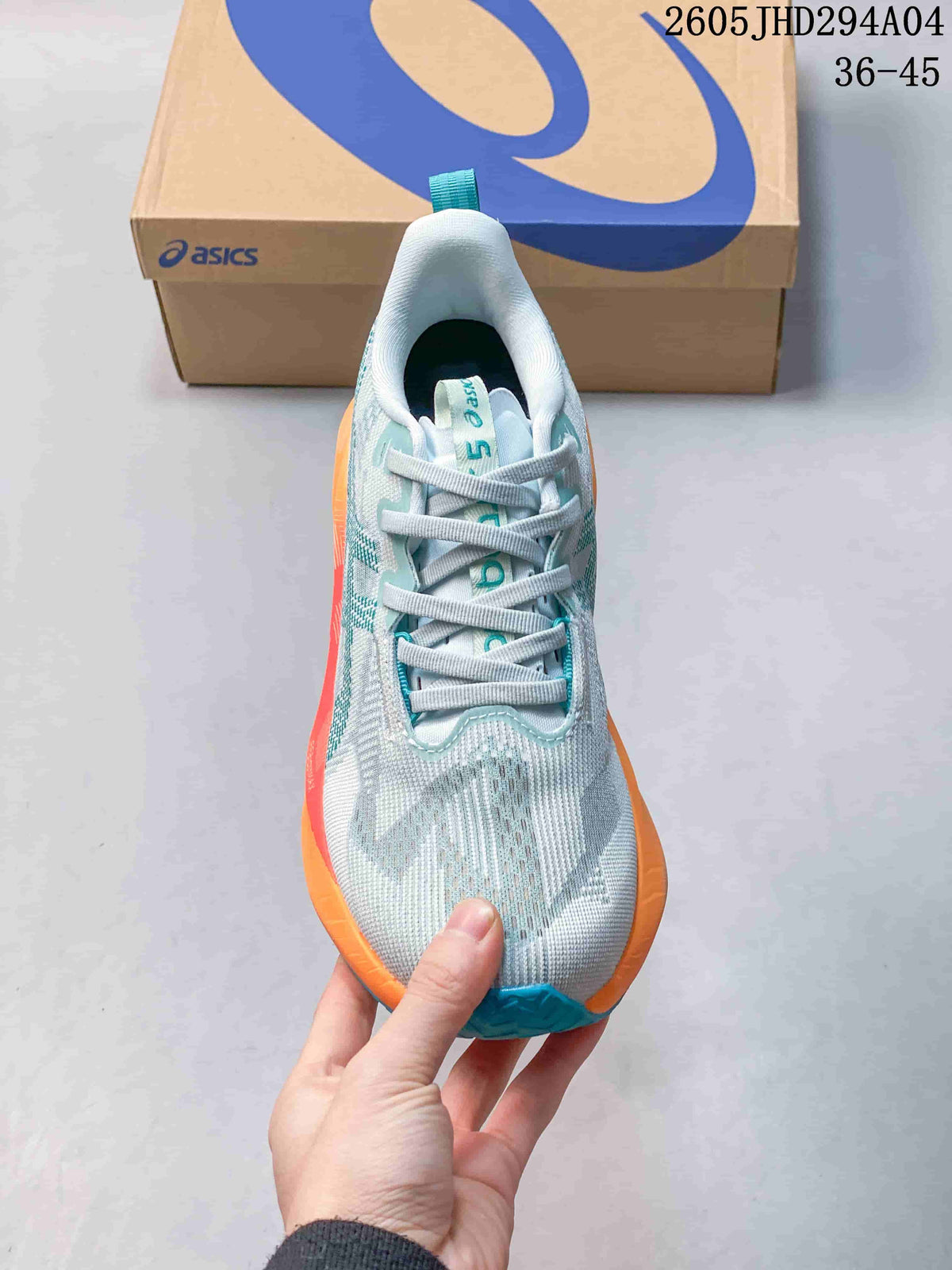 Top view of the lace-up running shoe with patterned upper and teal tongue details
