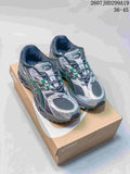 Pair of silver, dark gray and green ASICS Gel-Nimbus 10.1 sneakers displayed on an ASICS shoebox; image text shows 2607JHD299A19 and 36–45.