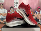 Pair of red and white Nike sneakers shown from the side