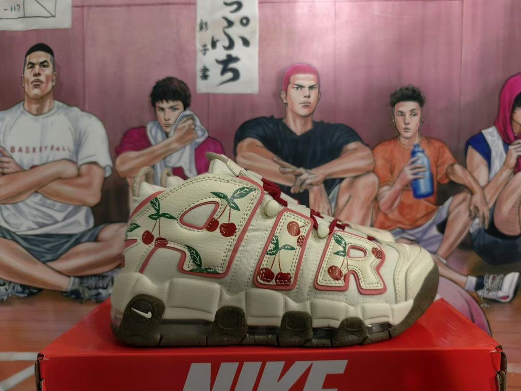 Side view showing oversized lettering, cherry graphics, and visible sole air unit